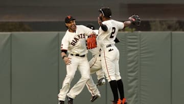May 22, 2016; San Francisco, CA, USA; San Francisco Giants outfielder Angel Pagan (16) celebrates with outfielder Denard Span (2) and outfielder Gregor Blanco (7) after defeating the Chicago Cubs 1-0 at AT&T Park. Mandatory Credit: Cary Edmondson-USA TODAY Sports