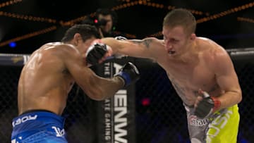 NEW YORK, NY - DECEMBER 31: Justin Gaethje (green/gray trunks) and challenger Luis Firmino (blue trunks) trade punches during their World Series of Fighting lightweight championship fight at The Theater at Madison Square Garden on December 31, 2016 in New York City. (Photo by Ed Mulholland/Getty Images)