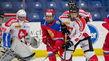 PLYMOUTH, MI - DECEMBER 11: Noah Meier #7 of the Switzerland Nationals battles for position with Alexandr Kisakov #21 of the U17 Russian Nationals during the 2018 Under-17 Four Nations Tournament game at USA Hockey Arena on December 11, 2018 in Plymouth, Michigan. Russia defeated Switzerland 9-1. (Photo by Dave Reginek/Getty Images)
