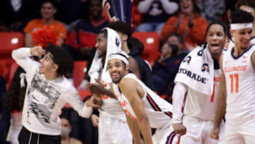 Dec 18, 2021; Champaign, Illinois, USA; Illinois Fighting Illini guard Jacob Grandison (3), center, watch the action in the final minute of the second half against the Saint Francis Red Flash at State Farm Center. Mandatory Credit: Ron Johnson-USA TODAY Sports