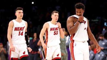 Kyle Lowry #7, Tyler Herro #14 and Duncan Robinson #55 of the Miami Heat look on after losing to the Los Angeles Lakers(Photo by Sean M. Haffey/Getty Images)