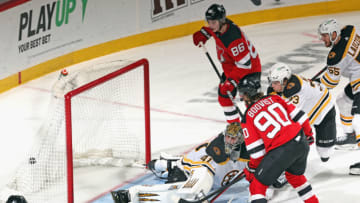 NEWARK, NEW JERSEY - MAY 04: Jesper Boqvist #90 of the New Jersey Devils scores a third period goal against Jaroslav Halak #41 of the Boston Bruins at the Prudential Center on May 04, 2021 in Newark, New Jersey. (Photo by Bruce Bennett/Getty Images)