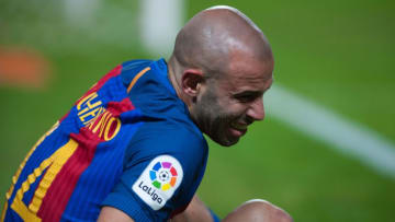 Barcelona's Argentinian midfielder Javier Mascherano reacts as he sits on the pitch during the Spanish league football match Sevilla FC vs FC Barcelona at the Ramon Sanchez Pizjuan stadium in Sevilla on November 6, 2016. / AFP / JORGE GUERRERO (Photo credit should read JORGE GUERRERO/AFP/Getty Images)