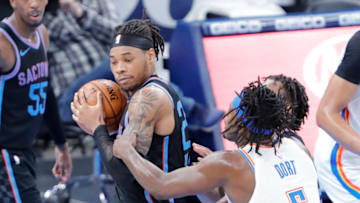 Kings center Richaun Holmes (22) is fouled by OKC Thunder forward Luguentz Dort (5): Alonzo Adams-USA TODAY Sports