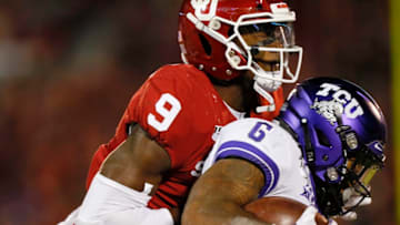 NORMAN, OK - NOVEMBER 23: Linebacker Kenneth Murray #9 of the Oklahoma Sooners stops running back Darius Anderson #6 of the TCU Horned Frogs for a one-yard loss in the fourth quarter on November 23, 2019 at Gaylord Family Oklahoma Memorial Stadium in Norman, Oklahoma. OU held on to win 28-24. (Photo by Brian Bahr/Getty Images)