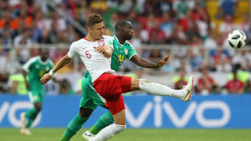 MOSCOW, RUSSIA - JUNE 19: Jan Bednarek of Poland challenge for the ball with Moussa Konate of Senegal during the 2018 FIFA World Cup Russia group H match between Poland and Senegal at Spartak Stadium on June 19, 2018 in Moscow, Russia. (Photo by Kevin C. Cox/Getty Images)
