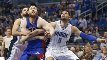Apr 6, 2016; Orlando, FL, USA; Detroit Pistons center Aron Baynes (center) battles for a rebound with Orlando Magic center Nikola Vucevic (9) and guard Evan Fournier during the second half of a basketball game at Amway Center. The Pistons won 108-104. Mandatory Credit: Reinhold Matay-USA TODAY Sports