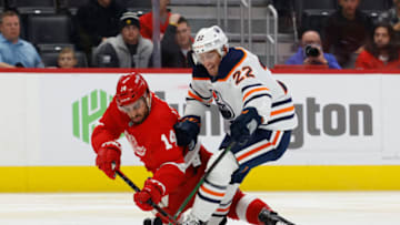 Detroit Red Wings center Robby Fabbri (14) and Edmonton Oilers defenseman Tyson Barrie (22) battle for the puck. Mandatory Credit: Rick Osentoski-USA TODAY Sports