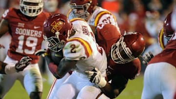 Nov 7, 2015; Norman, OK, USA; Iowa State Cyclones running back Mike Warren (2) is tackled by Oklahoma Sooners defensive tackle Charles Walker (97) during the fourth quarter at Gaylord Family - Oklahoma Memorial Stadium. Mandatory Credit: Mark D. Smith-USA TODAY Sports
