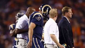Aug 23, 2014; Cleveland, OH, USA; St. Louis Rams quarterback Sam Bradford (8) is helped off the field after getting injury in the first quarter against the Cleveland Browns at FirstEnergy Stadium. Mandatory Credit: Rick Osentoski-USA TODAY Sports