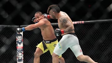 Oct 1, 2016; Portland, OR, USA; John Lineker (red gloves) fights against John Dodson (blue gloves) during UFC Fight Night at Moda Center. Mandatory Credit: Jaime Valdez-USA TODAY Sports