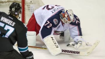 Oct 23, 2014; San Jose, CA, USA; Columbus Blue Jackets goalie Sergei Bobrovsky (72) blocks a shot by San Jose Sharks center Tommy Wingels (57) during the first period at SAP Center at San Jose. Mandatory Credit: Ed Szczepanski-USA TODAY Sports