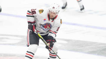 IceHogs Evan Barratt plays the puck against the Grand Rapid Griffins at BMO Harris Bank Center on Saturday, Nov. 6, 2021, in Rockford. The IceHogs split games with the Griffins on Saturday and Sunday as they returned to the arena.Ice Hogs Opening Night002