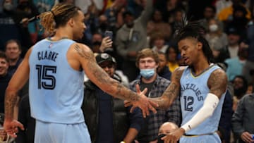 Jan 11, 2022; Memphis, Tennessee, USA; Memphis Grizzles forward Brandon Clarke (15) and guard Ja Morant (12) celebrate after a basket during the second half against the Golden State Warriors at FedExForum. (Petre Thomas-USA TODAY Sports)