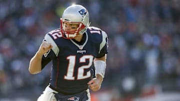Dec 4, 2016; Foxborough, MA, USA; New England Patriots quarterback Tom Brady (12) celebrates after a touchdown during the first quarter against the Los Angeles Rams at Gillette Stadium. Mandatory Credit: Greg M. Cooper-USA TODAY Sports