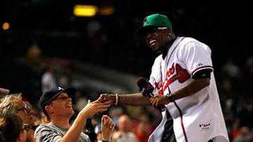 ATLANTA - JUNE 15: Musician Big Boi enjoys a laugh after singing "Take Me Out to the Ball Game" during the seventh inning between the Tampa Bay Rays and the Atlanta Braves at Turner Field on June 15, 2010 in Atlanta, Georgia. (Photo by Kevin C. Cox/Getty Images)