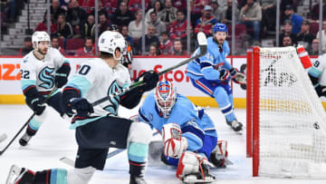 Eeli Tolvanen #20 of the Seattle Kraken scores on goaltender Sam Montembeault #35 of the Montreal Canadiens during the first period at Centre Bell on January 9, 2023 in Montreal, Quebec, Canada. (Photo by Minas Panagiotakis/Getty Images)