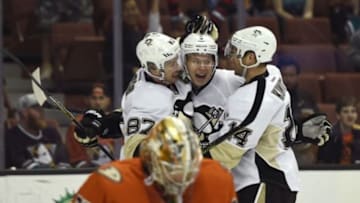 Dec 6, 2015; Anaheim, CA, USA; Pittsburgh Penguins defenseman Olli Maatta (center) celebrates with Pittsburgh Penguins center Sidney Crosby (left) and Pittsburgh Penguins left wing Chris Kunitz (right) after he scores a goal against the Anaheim Ducks during the first period at Honda Center. Mandatory Credit: Kelvin Kuo-USA TODAY Sports