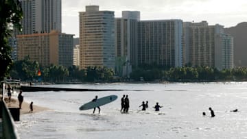 HONOLULU - DECEMBER 29: Beach goers enjoy the warm waters on Waikiki Beach December 29, 2004 in Honolulu, Hawaii. With many of Hawaii's prime hotels, condominiums, and homes on beachfront property, Hawaii could suffer a similar tragedy to the tsunami which ravaged many parts of South Asia and surrounding areas. Hawaii maintains a vigilant watch over global earthquake activity monitoring tsunami activity in the Pacific Ocean. The state has a well developed tsunami warning system in place to warn of on coming tsunami in prone areas. (Photo by Marco Garcia/Getty Images)