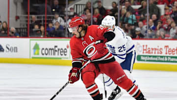 RALEIGH, NC - NOVEMBER 24: Justin Faulk #27 of the Carolina Hurricanes moves the puck against the Toronto Maple Leafs during their game at PNC Arena on November 24, 2017 in Raleigh, North Carolina. (Photo by Grant Halverson/Getty Images)