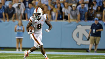 Miami Hurricanes Dee Wiggins runs against the North Carolina Tar Heels. Getty Images.