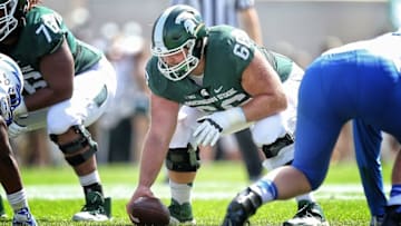 Sep 19, 2015; East Lansing, MI, USA; Michigan State Spartans center Jack Allen (66) prepares to snap the ball during the 1st quarter of a game against the Air Force Falcons at Spartan Stadium. Mandatory Credit: Mike Carter-USA TODAY Sports