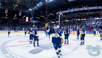 REGINA, SK - MAY 18: Sam Steel #23 of the Regina Pats raises his stick and salutes fans after a game 1 win against the Hamilton Bulldogs at Brandt Centre - Evraz Place on May 18, 2018 in Regina, Canada. (Photo by Marissa Baecker/Getty Images)