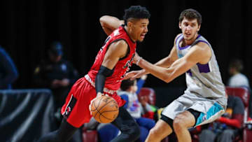 HOFFMAN ESTATES, IL - JANUARY 12: Kaiser Gates #21 of the Windy City Bulls drives to the basket against Luke Petrasek #18 of the Greensboro Swarm during the third quarter of an NBA G-League game on January 12, 2019 at Sears Centre Arena in Hoffman Estates, Illinois. NOTE TO USER: User expressly acknowledges and agrees that, by downloading and or using this photograph, User is consenting to the terms and conditions of the Getty Images License Agreement. Mandatory Copyright Notice: Copyright 2019 NBAE (Photo by Kamil Krzaczynski/NBAE via Getty Images)