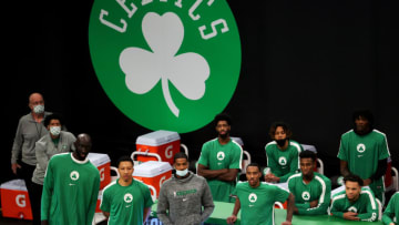 BOSTON, MASSACHUSETTS - DECEMBER 18: Members of the Boston Celtics look on from the bench during the preseason game against the Brooklyn Netsat TD Garden on December 18, 2020 in Boston, Massachusetts. NOTE TO USER: User expressly acknowledges and agrees that, by downloading and or using this photograph, User is consenting to the terms and conditions of the Getty Images License Agreement. (Photo by Maddie Meyer/Getty Images)