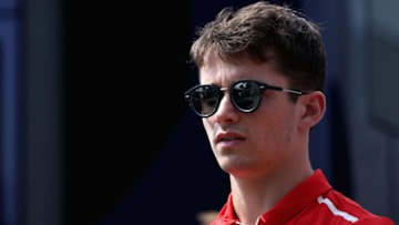 MONZA, ITALY - AUGUST 31: F2 driver Charles Leclerc of Monaco and Prema Racing walks in the Paddock during previews for the Formula One Grand Prix of Italy at Autodromo di Monza on August 31, 2017 in Monza, Italy. (Photo by Mark Thompson/Getty Images)