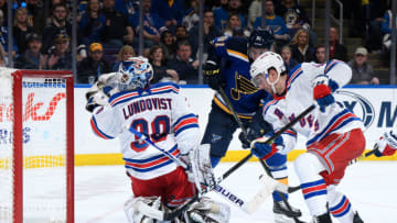 ST. LOUIS, MO - DECEMBER 31: Henrik Lundqvist #30 of the New York Rangers and Neal Pionk #44 of the New York Rangers defend the net against Vladimir Tarasenko #91 of the St. Louis Blues at Enterprise Center on December 31, 2018 in St. Louis, Missouri. (Photo by Scott Rovak/NHLI via Getty Images)