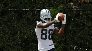 Jun 17, 2014; Dallas, TX, USA; Dallas Cowboys receiver Dez Bryant (88) catches footballs during minicamp at Cowboys headquarters at Valley Ranch. Mandatory Credit: Matthew Emmons-USA TODAY Sports