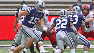 MANHATTAN, KS - SEPTEMBER 12: Quarterback Will Howard #15 of the Kansas State Wildcats hands the ball off to running back Deuce Vaughn #22 during the second half against the Arkansas State Red Wolves at Bill Snyder Family Football Stadium on September 12, 2020 in Manhattan, Kansas. (Photo by Peter G. Aiken/Getty Images)