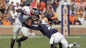 Nov 14, 2015; Auburn, AL, USA; Georgia Bulldogs tailback Sony Michel (1) avoids the tackle of Auburn Tigers defensive back Blake Countess (24) during the third quarter at Jordan Hare Stadium. The Bulldogs beat the Tigers 20-13. Mandatory Credit: John Reed-USA TODAY Sports