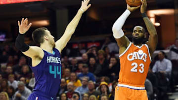 Dec 10, 2016; Cleveland, OH, USA; Cleveland Cavaliers forward LeBron James (23) shoots over the defense of Charlotte Hornets center Frank Kaminsky III (44) during the second half at Quicken Loans Arena. Mandatory Credit: Ken Blaze-USA TODAY Sports