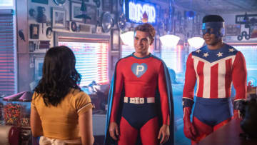 Riverdale -- "Chapter Sixty-One: Halloween" -- Image Number: RVD404b_0249.jpg -- Pictured (L-R): Camila Mendes as Veronica, KJ Apa as Archie and Eli Goree as Munroe -- Photo: Jack Rowand/The CW -- © 2019 The CW Network, LLC. All Rights Reserved.