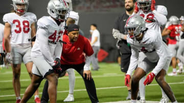 Ohio State Buckeyes secondary coach Tim Walton works with cornerbacks Lloyd McFarquhar (42) and Lejond Cavazos (4) during a spring football practice at the Woody Hayes Athletics Center in Columbus on March 22, 2022.Ncaa Football Ohio State Spring Practice