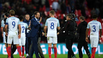 LONDON, ENGLAND - OCTOBER 05: Gareth Southgate, manager of England and Jordan Henderson of England celebrate victory and World Cup Finals qualification after the FIFA 2018 World Cup Group F Qualifier between England and Slovenia at Wembley Stadium on October 5, 2017 in London, England. (Photo by Laurence Griffiths/Getty Images)
