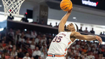 Auburn basketball guard Devan Cambridge (35) dunks the ball as Auburn Tigers men's basketball takes on Texas A&M Aggies at Auburn Arena in Auburn, Ala., on Saturday, Feb. 12, 2022. Auburn Tigers lead Texas A&M Aggies 33-18 at halftime.
