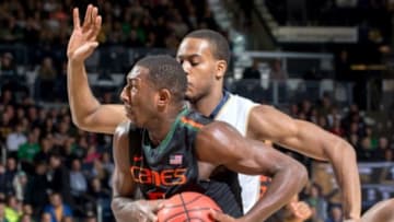 Jan 17, 2015; South Bend, IN, USA; Miami Hurricanes guard Davon Reed (5) drives to the basket as Notre Dame Fighting Irish forward V.J. Beachem (3) defends in the first half at the Purcell Pavilion. Notre Dame won 75-70. Mandatory Credit: Matt Cashore-USA TODAY Sports