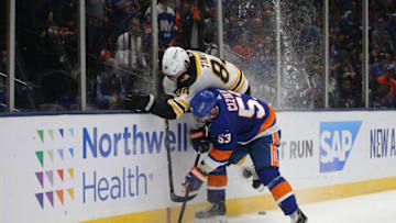 Jun 9, 2021; Uniondale, New York, USA; New York Islanders center Casey Cizikas (53) hits Boston Bruins defenseman Jarred Tinordi (84) during the second period of game six of the second round of the 2021 Stanley Cup Playoffs at Nassau Veterans Memorial Coliseum. Mandatory Credit: Brad Penner-USA TODAY Sports