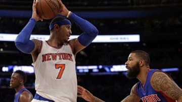 Mar 5, 2016; New York, NY, USA; New York Knicks forward Carmelo Anthony (7) looks to pass defended by Detroit Pistons forward Marcus Morris (13) during the second half at Madison Square Garden. The Knicks defeated the Pistons 102-89. Mandatory Credit: Adam Hunger-USA TODAY Sports