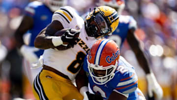 Florida Gators linebacker Amari Burney (2) tackles Missouri Tigers running back Nathaniel Peat (8) during the first half at Steve Spurrier Field at Ben Hill Griffin Stadium in Gainesville, FL on Saturday, October 8, 2022. [Matt Pendleton/Gainesville Sun]Ncaa Football Florida Gators Vs Missouri Tigers