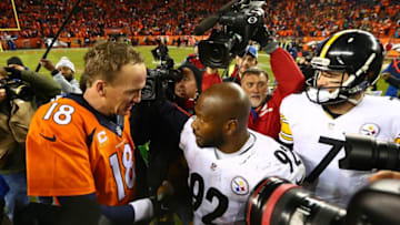 Jan 17, 2016; Denver, CO, USA; Denver Broncos quarterback Peyton Manning (18) shakes hands with Pittsburgh Steelers outside linebacker James Harrison (92) after the AFC Divisional round playoff game at Sports Authority Field at Mile High. Denver won 23-16. Mandatory Credit: Mark J. Rebilas-USA TODAY Sports