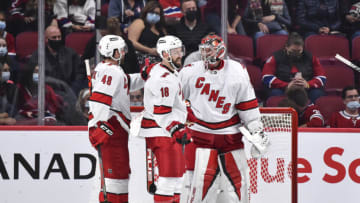 MONTREAL, QC - OCTOBER 21: (L-R) Jordan Martinook #48, Derek Stepan #18 and goaltender Frederik Andersen #31 of the Carolina Hurricanes celebrate their victory against the Montreal Canadiens at Centre Bell on October 21, 2021 in Montreal, Canada. The Carolina Hurricanes defeated the Montreal Canadiens 4-1. (Photo by Minas Panagiotakis/Getty Images)