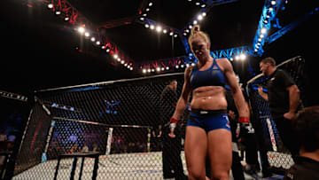 SINGAPORE - JUNE 17: Holly Holm exits the Octagon after knocking out Bethe Correia of Brazil in their women's bantamweight bout during the UFC Fight Night event at the Singapore Indoor Stadium on June 17, 2017 in Singapore. (Photo by Brandon Magnus/Zuffa LLC/Zuffa LLC via Getty Images)
