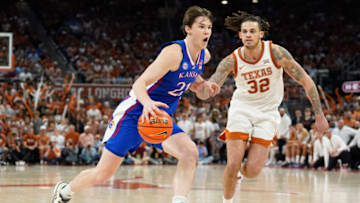 Mar 4, 2023; Austin, Texas, USA; Kansas Jayhawks forward Zach Clemence (21) drives on Texas Longhorns forward Christian Bishop (32) during the second half at Moody Center. Mandatory Credit: Scott Wachter-USA TODAY Sports