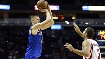Oct 4, 2016; Houston, TX, USA; New York Knicks forward Kristaps Porzingis (6) shoots the ball over Houston Rockets forward Ryan Anderson (3) during the third quarter at Toyota Center. The Rockets won 130-103. Mandatory Credit: Troy Taormina-USA TODAY Sports
