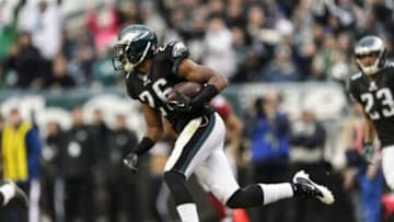 Dec 1, 2013; Philadelphia, PA, USA; Philadelphia Eagles cornerback Cary Williams (26) runs back an interception during the third quarter against the Arizona Cardinals at Lincoln Financial Field. The Eagles defeated the Cardinals 24-21. Mandatory Credit: Howard Smith-USA TODAY Sports