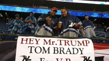 FOXBORO, MA - SEPTEMBER 10: Fans stand with a sign stating 'Hey Mr. Trump Tom Brady for V.P.' before the game between the New England Patriots and the Pittsburgh Steelers at Gillette Stadium on September 10, 2015 in Foxboro, Massachusetts. (Photo by Jim Rogash/Getty Images)
